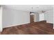 Spacious dining area with hardwood floors, fireplace and barn door at 515 N Boyd St, Winter Garden, FL 34787