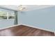 Spacious bedroom with light blue walls and wood floors at 515 N Boyd St, Winter Garden, FL 34787