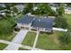 Aerial view of a remodeled home with a large driveway at 515 N Boyd St, Winter Garden, FL 34787
