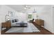 Large main bedroom with wood-look floors and plenty of natural light at 515 N Boyd St, Winter Garden, FL 34787