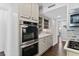 Modern kitchen features stainless steel appliances and white shaker cabinets at 515 N Boyd St, Winter Garden, FL 34787