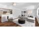 Spacious living room with hardwood floors and a comfortable sectional sofa at 515 N Boyd St, Winter Garden, FL 34787