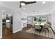Dining room with hardwood floors, kitchen view and a stylish chandelier at 515 N Boyd St, Winter Garden, FL 34787