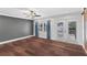 Bright bedroom with wood floors and French doors at 515 N Boyd St, Winter Garden, FL 34787