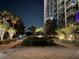 Landscaped courtyard with trees and lighting at night at 155 S Court Ave # 2310, Orlando, FL 32801