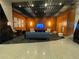 Modern building lobby with comfortable seating and a large TV at 155 S Court Ave # 2310, Orlando, FL 32801