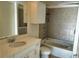 Bathroom with a large vanity and bathtub at 155 S Court Ave # 2310, Orlando, FL 32801