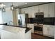 Modern kitchen with stainless steel appliances and white cabinets at 155 S Court Ave # 2310, Orlando, FL 32801