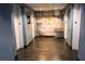 Clean hallway with elevators and modern wall art at 155 S Court Ave # 2310, Orlando, FL 32801