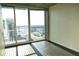 Bedroom with hardwood floors and stunning city view at 155 S Court Ave # 2310, Orlando, FL 32801