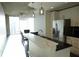 Modern kitchen with stainless steel appliances and white cabinets at 155 S Court Ave # 2310, Orlando, FL 32801