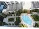 Aerial view of resort-style pool with lounge chairs and landscaping at 155 S Court Ave # 2310, Orlando, FL 32801