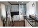 Modern kitchen with stainless steel appliances and white cabinets at 155 S Court Ave # 2310, Orlando, FL 32801