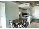 Dining area with dark wood table and chairs near kitchen at 155 S Court Ave # 2310, Orlando, FL 32801