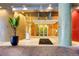 Modern building entrance with sleek design and landscaping at 155 S Court Ave # 2310, Orlando, FL 32801