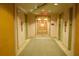 Building hallway with carpeted floors and elevators at 155 S Court Ave # 2310, Orlando, FL 32801