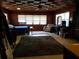 Large bedroom with wood walls, ceiling fan, and ample space at 1050 S Main Ave, Groveland, FL 34736