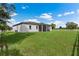 Large backyard with grassy area and white fence at 3429 Boggy Creek Rd, Kissimmee, FL 34744