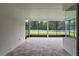 Spacious screened porch with paver flooring and backyard view at 3429 Boggy Creek Rd, Kissimmee, FL 34744