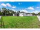 Large backyard with grassy area and white fence at 3429 Boggy Creek Rd, Kissimmee, FL 34744