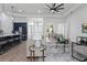 Open living room with kitchen, dining, and high ceilings at 530 Boggy Creek Rd # 3429, Kissimmee, FL 34744