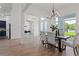 Open concept dining room with modern chandelier at 3429 Boggy Creek Rd, Kissimmee, FL 34744