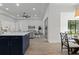 Open kitchen with island and views to Gathering room and dining area at 3429 Boggy Creek Rd, Kissimmee, FL 34744