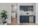 Well-appointed kitchenette with modern appliances and cabinetry at 3429 Boggy Creek Rd, Kissimmee, FL 34744