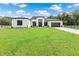 Modern house exterior with green lawn and driveway at 3429 Boggy Creek Rd, Kissimmee, FL 34744