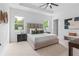 Spacious bedroom with plush bed and large windows at 3429 Boggy Creek Rd, Kissimmee, FL 34744