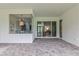 Relaxing screened porch offering views of the backyard at 3429 Boggy Creek Rd, Kissimmee, FL 34744