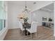 Bright dining room with chandelier and seating for six at 3429 Boggy Creek Rd, Kissimmee, FL 34744