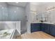 Spa-like bathroom with a double vanity and a walk-in shower at 530 Boggy Creek Rd # 3429, Kissimmee, FL 34744