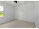 Spacious bedroom with carpeted floor, neutral walls, and a window at 3429 Boggy Creek Rd, Kissimmee, FL 34744