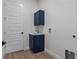 Laundry room with blue cabinets and tile floors at 3429 Boggy Creek Rd, Kissimmee, FL 34744