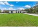 Modern house exterior with green lawn and driveway at 3429 Boggy Creek Rd, Kissimmee, FL 34744