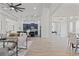 Open living room with a view into the modern kitchen at 3429 Boggy Creek Rd, Kissimmee, FL 34744