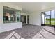 Spacious screened patio with paver surface and views of the backyard at 3429 Boggy Creek Rd, Kissimmee, FL 34744