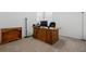 Home office featuring a large desk and neutral carpeting at 2658 Mandevilla Ct, Clermont, FL 34711