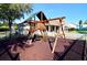 playground with climbing structures and swings at 618 Brunello Dr, Davenport, FL 33897