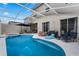 Large pool and spa with patio furniture and a covered lanai at 618 Brunello Dr, Davenport, FL 33897