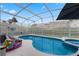 Relaxing pool area with a spa and patio furniture at 618 Brunello Dr, Davenport, FL 33897