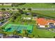 Aerial view showing tennis courts, playground, and clubhouse at 618 Brunello Dr, Davenport, FL 33897