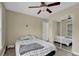 Spacious bedroom with large window, ceiling fan and mirrored closet doors at 4866 Conway Rd # 116, Orlando, FL 32812