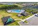 Aerial view of community pool, playground and parking at 4544 White Marble Ct, Lakeland, FL 33811