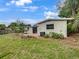 Home's backyard features a grassy lawn and patio at 171 Ronnie Dr, Altamonte Springs, FL 32714