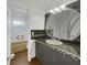 Bathroom with dark vanity, large mirror, and tub at 171 Ronnie Dr, Altamonte Springs, FL 32714
