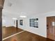 Living room with wood flooring and large mirror at 171 Ronnie Dr, Altamonte Springs, FL 32714