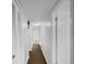 Long hallway with hardwood floors and white walls at 171 Ronnie Dr, Altamonte Springs, FL 32714