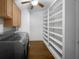 Bright laundry room, washer, dryer, and ample shelving at 171 Ronnie Dr, Altamonte Springs, FL 32714